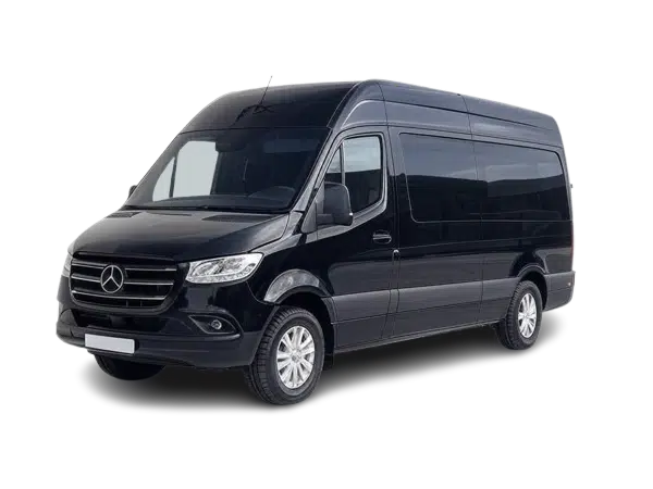 A high-roof executive black Sprinter van with custom luxury interior parked under a luxury hotel portico.